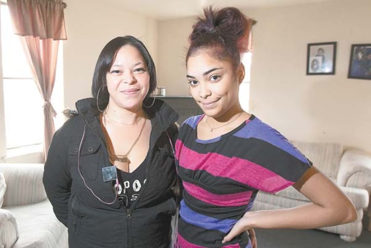 Claudia Varga writes about Camden's Community Education Resource Network , CERN, which has been lauded by state officials but due to funding cuts is near extinction. Here, Glenda Martes and her 15 year old daughter Miguelina stand in their living room in Camden. Miguelina recently dropped out of high school and is enrolling in the CERN home-schooling program. Glenda says it's the only alternative available to Camden's violent schools.( ED HILLE / Staff Photographer )