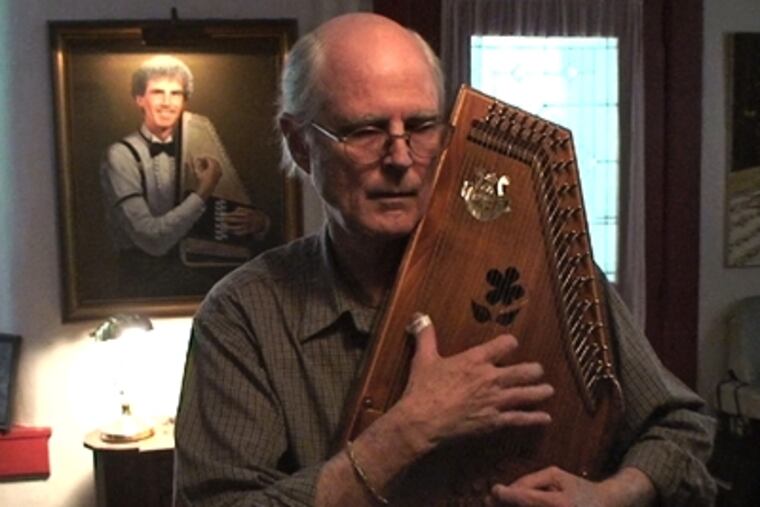 Ivan Stiles embraced the autoharp almost by accident; it was a serendipitous anniversary present from his wife more than 30 years ago. (DAVID M WARREN / Inquirer Staff Photographer)