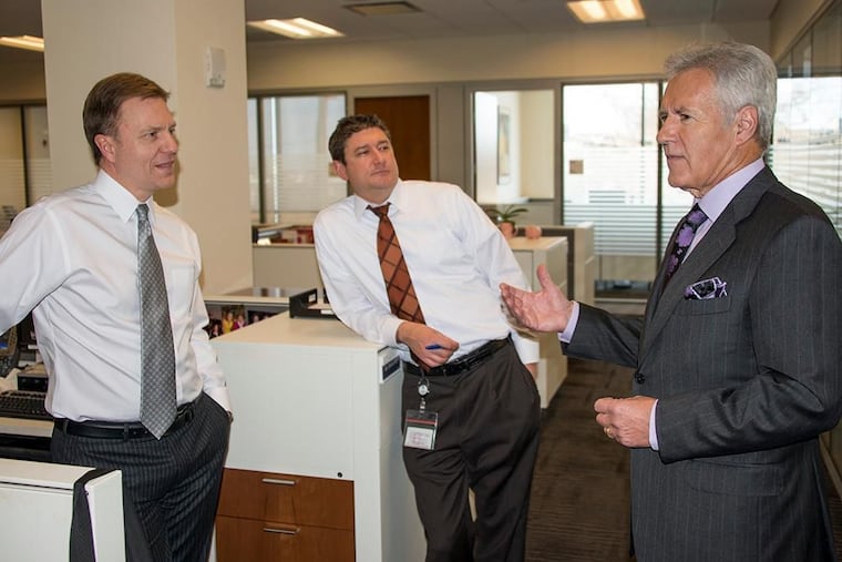 6ABC's president and general manager Bernie Prazenica, at left, and 6ABC vice president of marketing Mike Monsell, center, speak with Alex Trebek during one of his visits to 6ABC's studio in 2013.