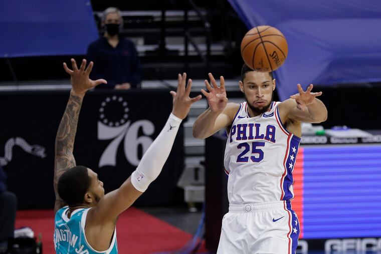 Sixers guard Ben Simmons passes the ball past Hornets forward P.J. Washington in the first quarter.