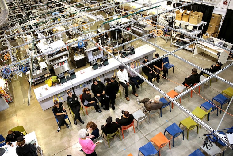 An overhead view of McDonald's Innovation Center in Romeoville, Ill., shows various setups, plenty of wiring and staff at the site. The fast-food operator tweaks routines and proposes ideas here that could quicken the operations at 34,000 restaurants worldwide.