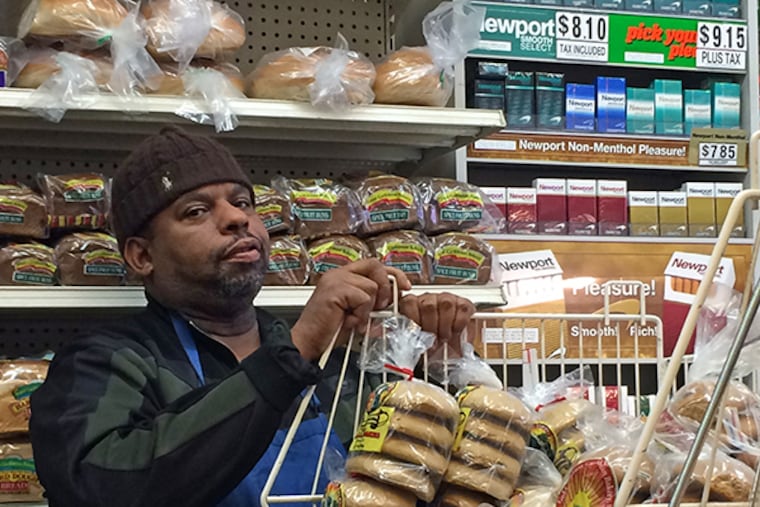 Travis Leslie, a clerk at Pats Caribbean Market in Mt. Airy, commented about significant sales declines because of the tax. (Staff Photo by Jason Laughlin)