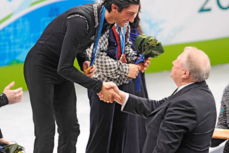 Evan Lysacek is the first American men's figure skater to win Olympic gold since 1988. (Clem Murray/Staff Photographer)
