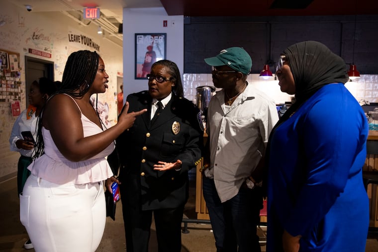 Norristown Police Chief Jacqueline Bailey-Davis, talks with Kendra Van de Water, co-founder of YEAH Philly, Ray Jones, and Tyler Wood after a pitch contest at REC Philly in Philadelphia on Aug. 12, 2024. Teens from different organizations put together videos and presentations to reduce gun violence.
