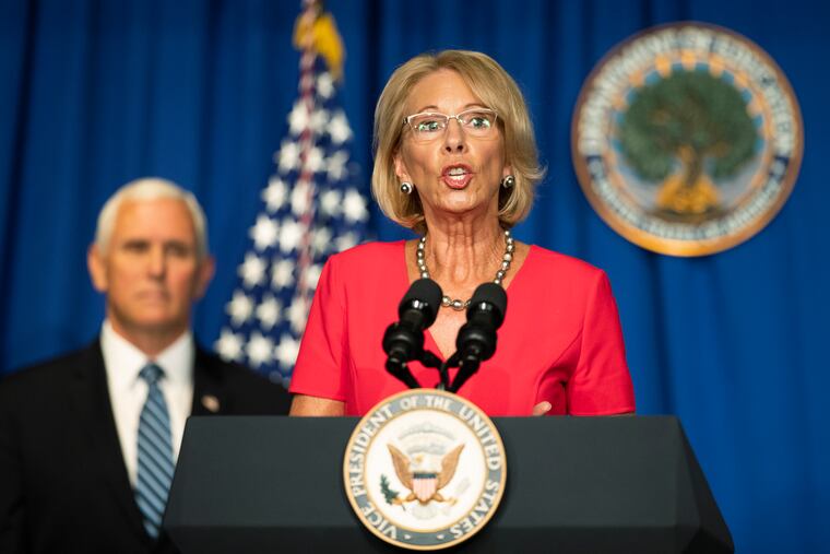 Education Secretary Betsy DeVos, with Vice President Mike Pence, speaks during a White House Coronavirus Task Force briefing at the Department of Education building Wednesday, July 8, 2020, in Washington.