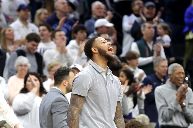Villanova's Justin Moore cheers for the Wildcats during their game against Oklahoma on Dec. 3 at the Wells Fargo Center.