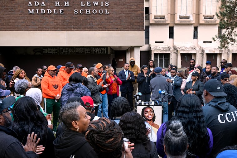 Community members turn out for a vigil in memory of Kada Scott at the former Ada H.H. Lewis Middle School, not far from where her body was found on Oct. 18. Abandoned school buildings symbolize the city's decay, Kristen Peeples writes.