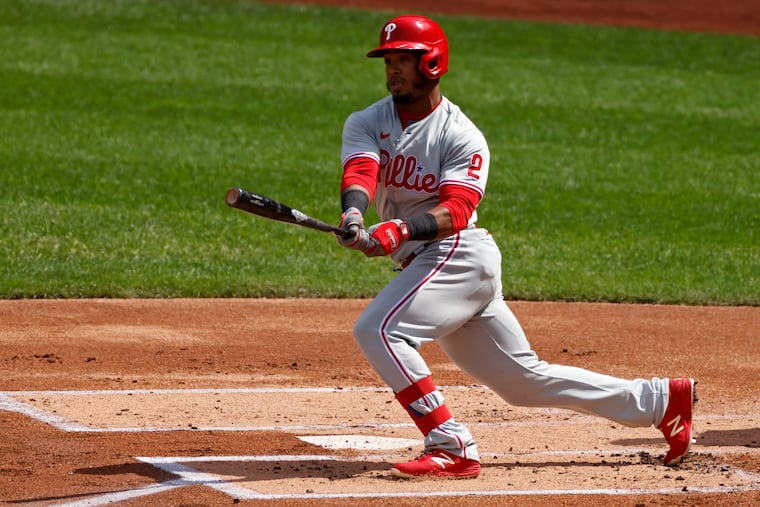 The Phillies' Jean Segura watches his three-RBI double during the first inning against the Mets.
