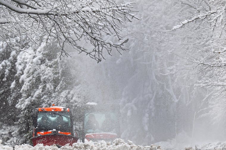 Snow removal vehicles plow through snow covered pathways at Swarthmore College on Feb. 23. It wasn't quite a blizzard in the Philly area, but blizzard conditions did occur at the Shore.