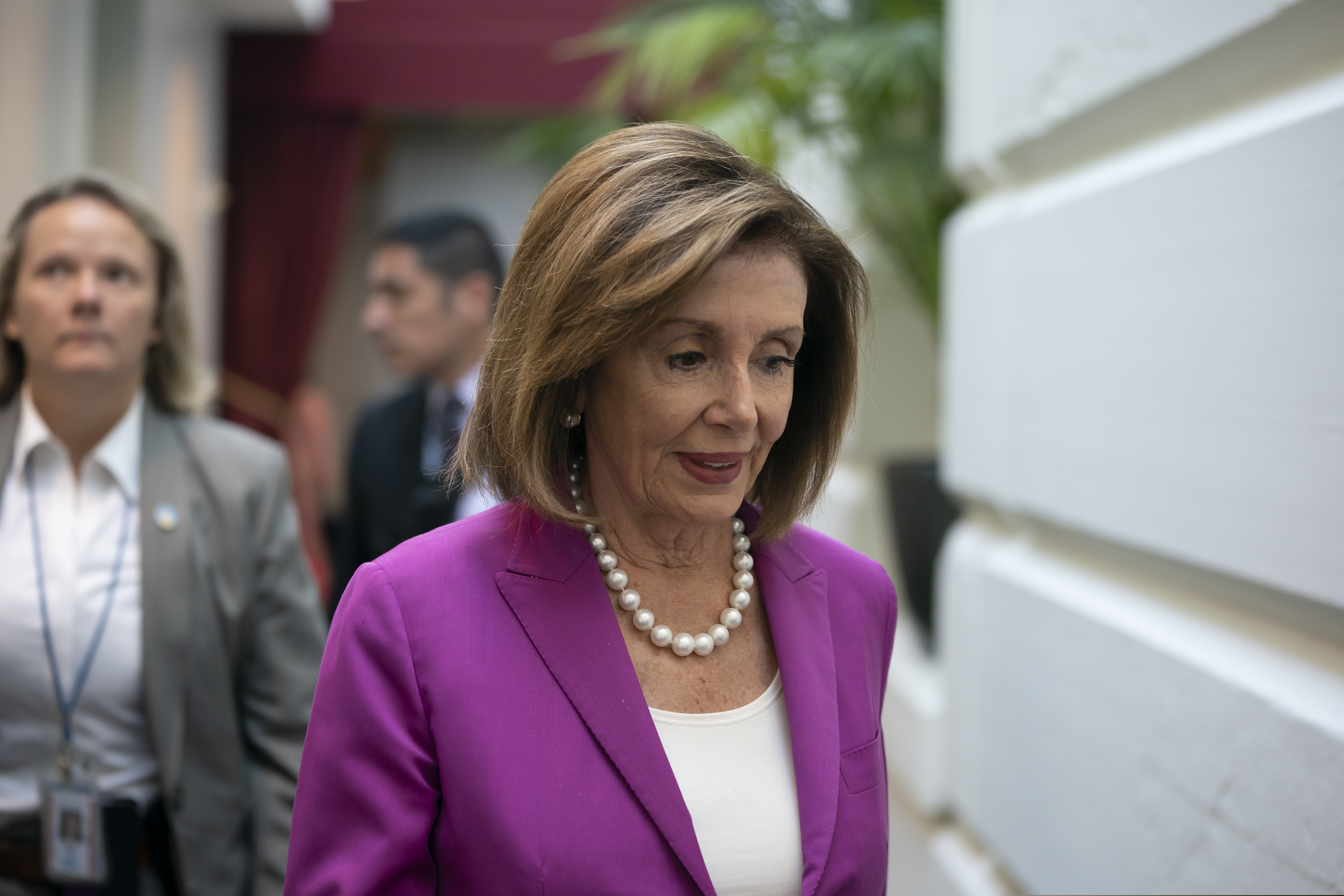 House Speaker Nancy Pelosi, D-Calif., arrives for a closed-door session with her caucus before a vote on a resolution condemning what she called "racist comments" by President Donald Trump at the Capitol in Washington, Tuesday, July 16, 2019. His remarks were directed at Reps. Ilhan Omar of Minnesota, Alexandria Ocasio-Cortez of New York, Ayanna Pressley of Massachusetts and Rashida Tlaib of Michigan.