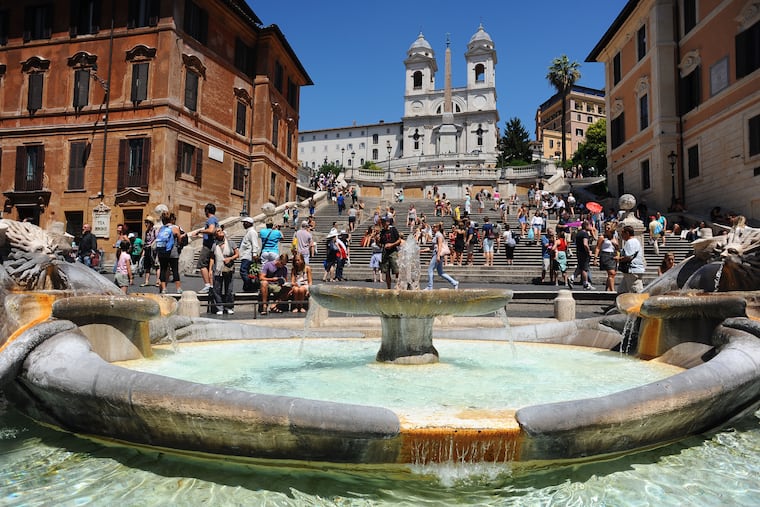 The Spanish Steps in Rome, as seen from the Fontana della Barcaccia in the Piazza di Spagna, with the Church of the Santissima Trinità dei Monti in the background.