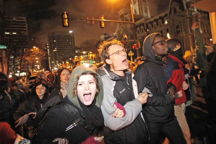 Occupy Philadelphia protesters leave Dilworth Plaza and head towards Walnut St. in this 2011 photo.
