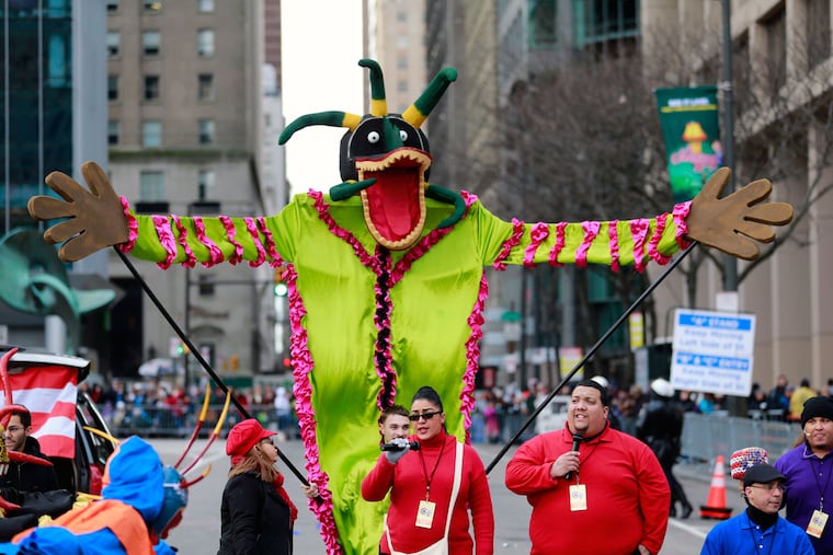 The Puerto Rican Heritage Group performs in front of the grandstand during the Mummers Parade on New Year's Day, Jan. 1, 2016.