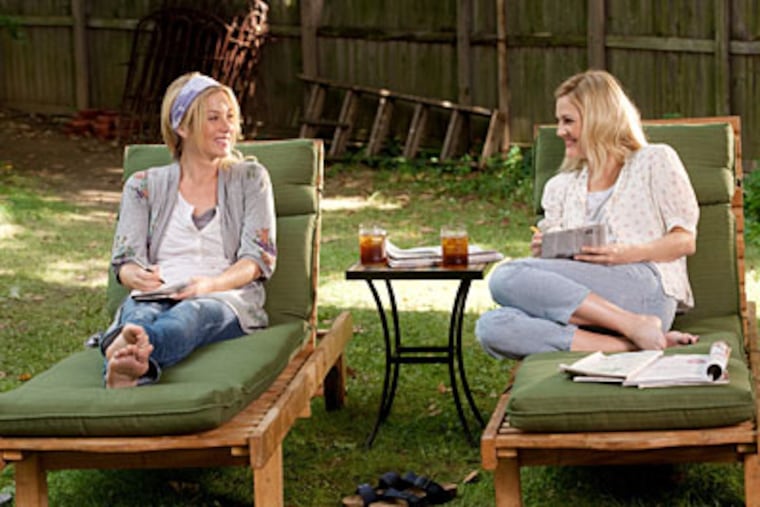 Drew Barrymore (right) plays half the couple separated by geography and Christina Applegate is her sister in "Going the Distance."