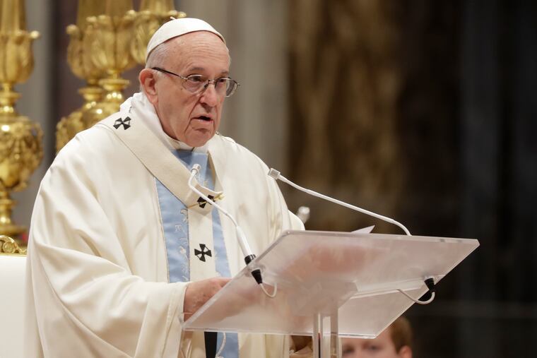 Pope Francis celebrates a new year Mass in St. Peter's Basilica at the Vatican on Tuesday.