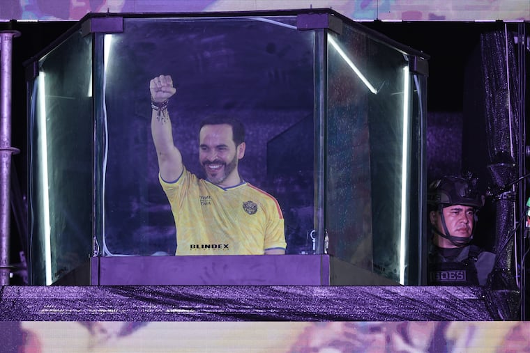 Abelardo de la Espriella speaks to supporters from inside a bulletproof booth at a celebration rally Sunday in Barranquilla, Colombia.