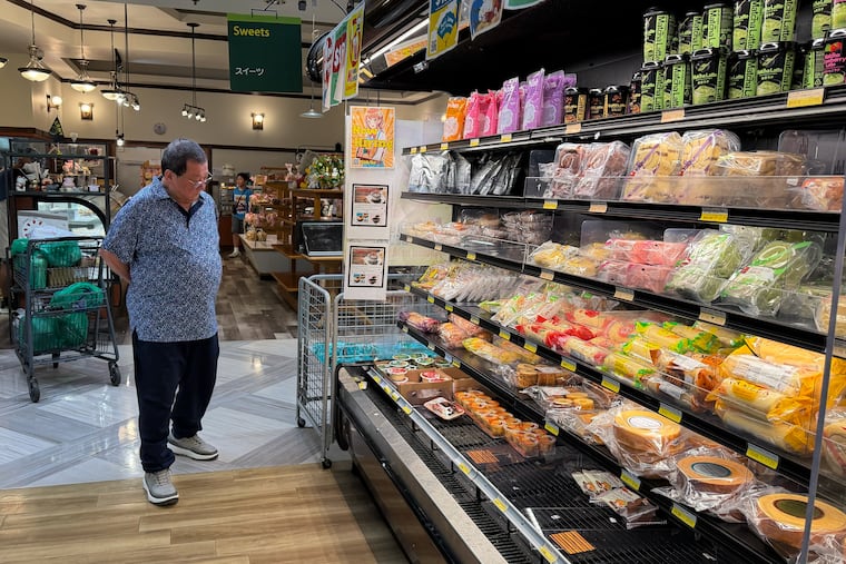 A customer shops at a grocery store in Arlington Heights, Ill., on July 6.