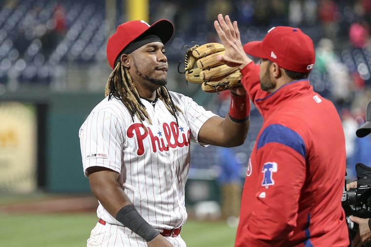 Phillies' Maikel Franco celebrates with manager Game Kapler after beating the Tigers 7-3. at Citizens Bank Park in Philadelphia, Wednesday, May 1, 2019 Franco's three run double put them ahead.