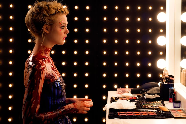 Just needs a touch-up: Elle Fanning as a doomed fashion model in "The Neon Demon."