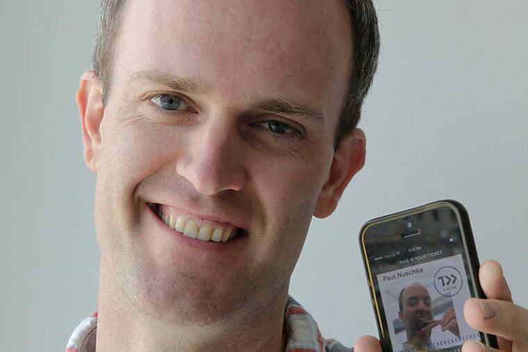 Designer Paul Nuschke of Ticketleap in Center City with an example of a selfie ticket taken with his cellphone. Ticket information is superimposed over the image, doing away with the need to scan a paper document.