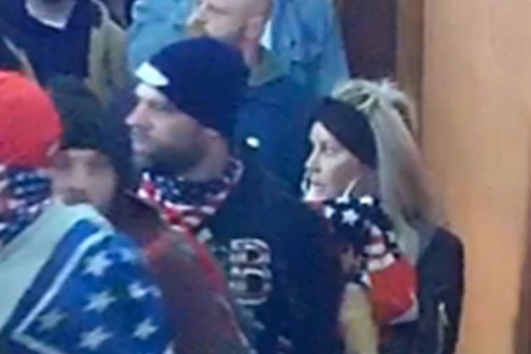 Rachel Myers (right) and Lawrence Earl Stackhouse (left) are shown in security footage from inside the U.S. Capitol in Washington as they stormed the building with a mob of supporters of former President Donald Trump on Jan. 6, 2021.