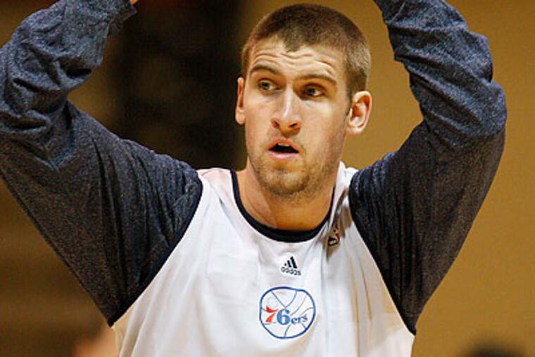 Andre Iguodala said Spencer Hawes is "kind of like Peyton Manning." (David Maialetti/Staff Photographer)