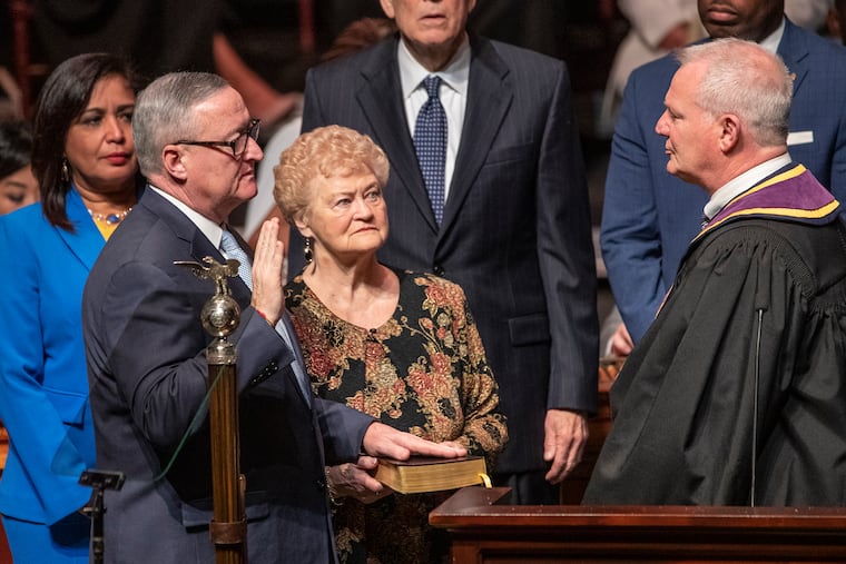 At the start of his second term, Mayor Jim Kenney, left, took the oath of office in January 2020 at an inauguration ceremony at the Met Philadelphia.