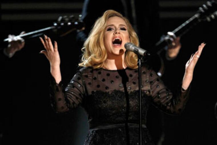 Adele performs during the 54th annual Grammy Awards on Sunday, Feb. 12, 2012 in Los Angeles. (AP Photo/Matt Sayles)