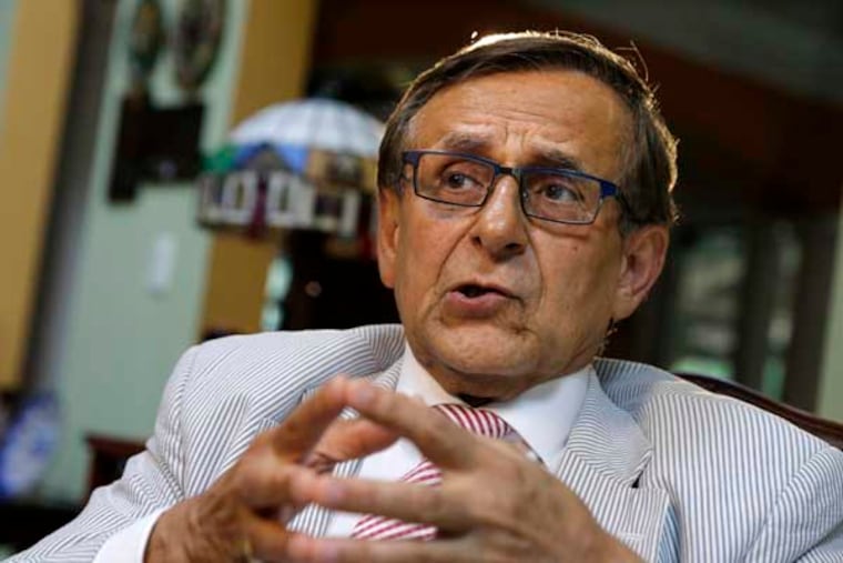 Rutgers professor Hooshang Amirahmadi ponders a question as he sits at his home Wednesday, July 9, 2014, in Princeton, N.J. An online magazine reported Wednesday that the National Security Agency and the FBI covertly scanned the emails of Amirahmadi and four other prominent Muslim-Americans under the U.S. government's secret surveillance program aimed at foreign terrorists and other national security threats. The magazine identified the targeted Muslim-Americans as lawyer Asim Ghafoor, Republican operative Faisal Gill, Rutgers University professor Hooshang Amirahmadi, activist Agha Saeed and Nihad Awad, executive director of the Council of American-Islamic Relations, a Muslim civil rights group. (AP Photo/Mel Evans)