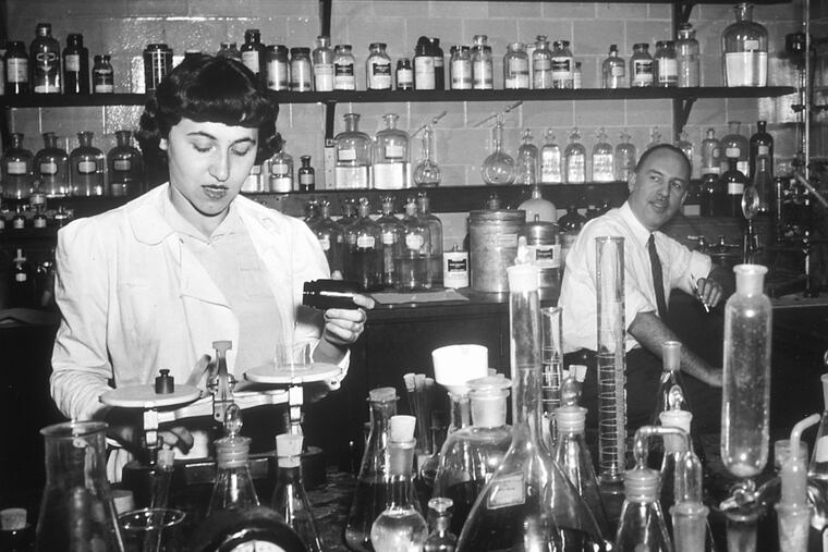 Jonathan Hartwell (right) and his assistant Sylvy R. Levy Kornberg conduct some of the earliest chemotherapy tests at the National Cancer Institute, about 1950.