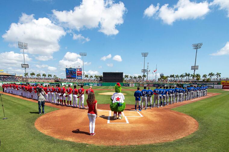 Philadelphia Phillies and Toronto Blue Jays, line up for Phillies spring training home opener at BayCare Ballpark in Clearwater, Florida, March 19, 2022.