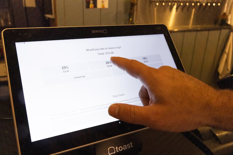 At Fat Lady Brewing Co., which closed in January, customers could leave tips in cash or electronically, as seen in this 2023 file photo.