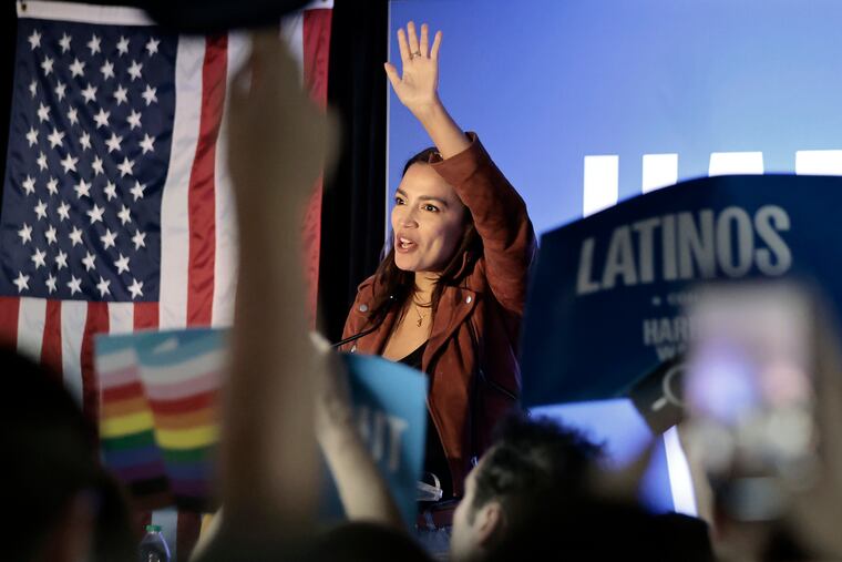 Rep. Alexandria Ocasio-Cortez energizes the crowd during a rally for Kamala Harris at the SEIU Local 32BJ union hall in Philadelphia on Sunday, October 20, 2024.