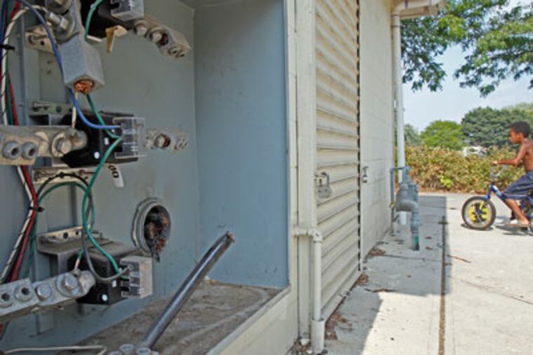 CAPTION -- Chopped off wires in the power box by the backside of the clubhouse/concession stand at Robert Johnson Park in Camden, NJ
( AKIRA SUWA / Staff Photographer )
Editors Note -- 7/16/2012 Following a string of brutal and violent teen deaths in Camden, school district officials decided to organize a peace rally at Robert Johnson Park. All set to go with planning the event, a school official discovered last week the wires had been cut from the main power line that feeds the Robert Johnson Park clubhouse and all the field lights. The theft of copper is one of CamdenÕs chronic issues.