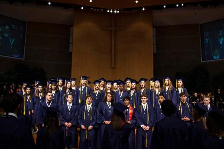 A choir sings at the Brookfield East High School graduation ceremony at Elmbrook Church Saturday, June 6, 2009, in Brookfield, Wis. A federal judge ruled Tuesday that the school district may continue to hold its graduation ceremonies in the church because the location doesn't necessarily make it a religious event. (AP Photo/Morry Gash, file)