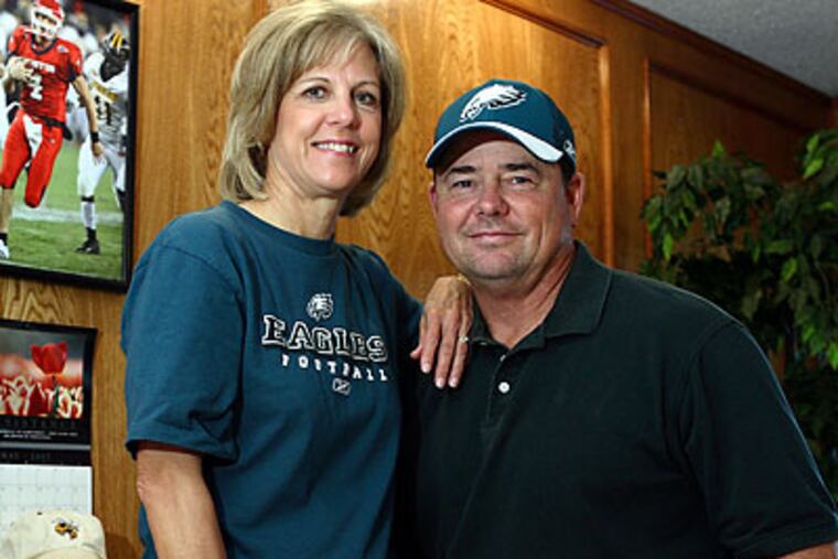 Kevin Kolb's father (right) has spent a lot of time in his life coaching football. (D.J. Peters/AP)
