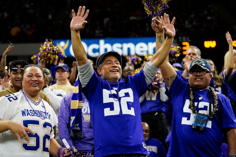 Fans cheer during the second half of Monday's Sugar Bowl game between Washington and Texas. The cost of tickets for the championship game on the secondary market are the highest ever in College Football Playoff history, according to Logitix.