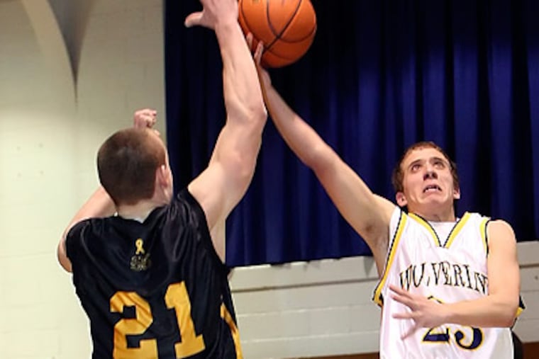 Bishop McDevitt's Drew Sigfreed tries to block Kennedy Kenrick's Frank Giunta during the 3rd quarter. Kennedy-Kenrick won 63-59. (Steven M. Falk / Staff Photographer )
