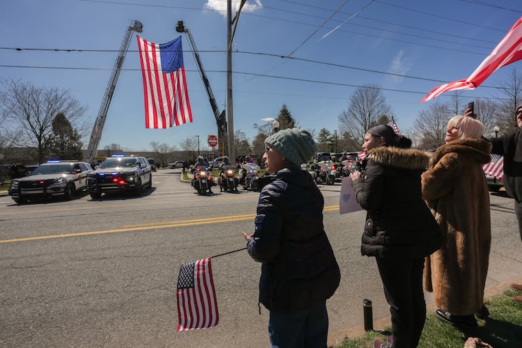 Supporters wait outside a funeral to pay their respects for Corporal Timothy J. O’Connor Jr., who lost his life in the line of duty on Sunday, March 8. The funeral was held at St. Joseph Parish, in Downingtown.