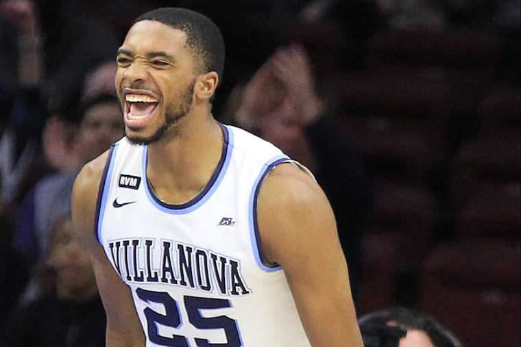 Mikal Bridges of Villanova celebrates after a dunk against Georgetown during the 1st half at the Wells Fargo Center on March 3, 2018.