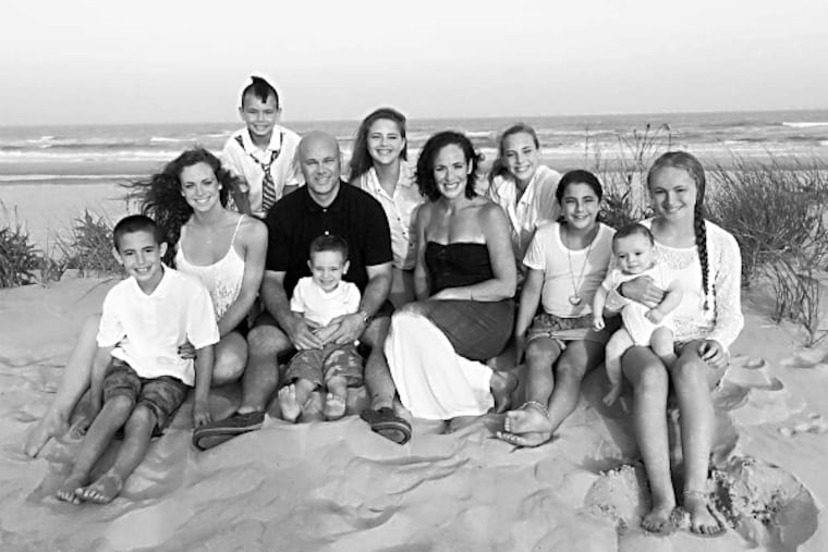 PHOTO COURTESY OF THE FILIPPO FAMILY The Filippos (from left): Roman (9), Hunter (20), Jameson (8), Ron (dad), Ben (3, in front of Ron), Francesca (14), Jenn (mom), Genevieve (12), Gioia (10), Noah (1), Sofia (15).