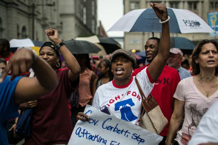 Hundreds of people march in support of public education outside of City Hall in Philadelphia on August 22, 2013. (Colin Kerrigan / Philly.com)