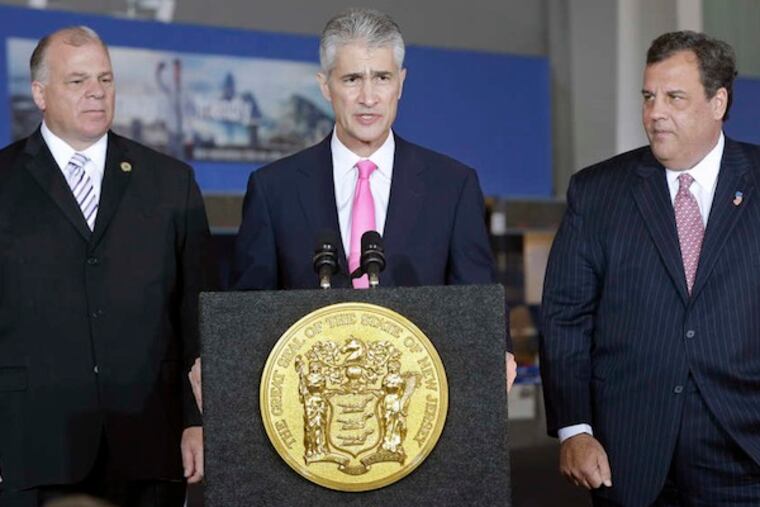 New Jersey Senate President Steve Sweeney, left, and Gov. Chris Christie, right, listen to United Airlines CEO Jeff Smisek at Newark Liberty International Airport, in Newark, N.J., Thursday, Nov. 14, 2013, as he announces that United Airlines will begin service to Atlantic City International Airport starting in April. (AP Photo/Mel Evans)