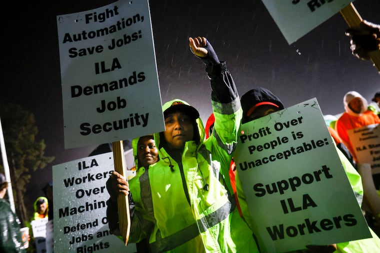 Dockworker Meikysha Wright and others strike outside the Virginia International Gateway in Portsmouth, Va., on Oct. 1.