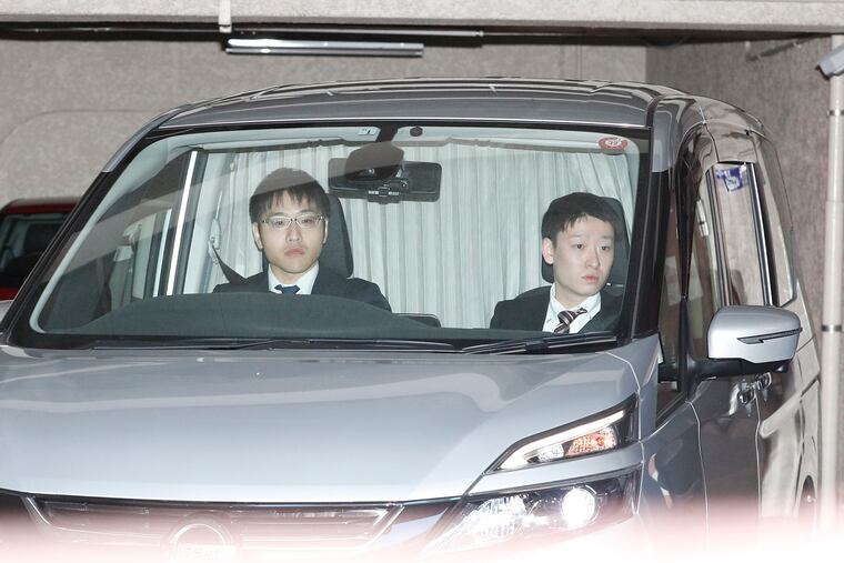 A car believed to be carrying former Nissan chairman Carlos Ghosn leaves an apartment building early Thursday, April 4, 2019 in Tokyo. Japanese prosecutors took Ghosn for questioning Thursday, barely a month after he was released on bail ahead of his trial on financial misconduct charges.(Takuya Inaba / Kyodo News via AP)