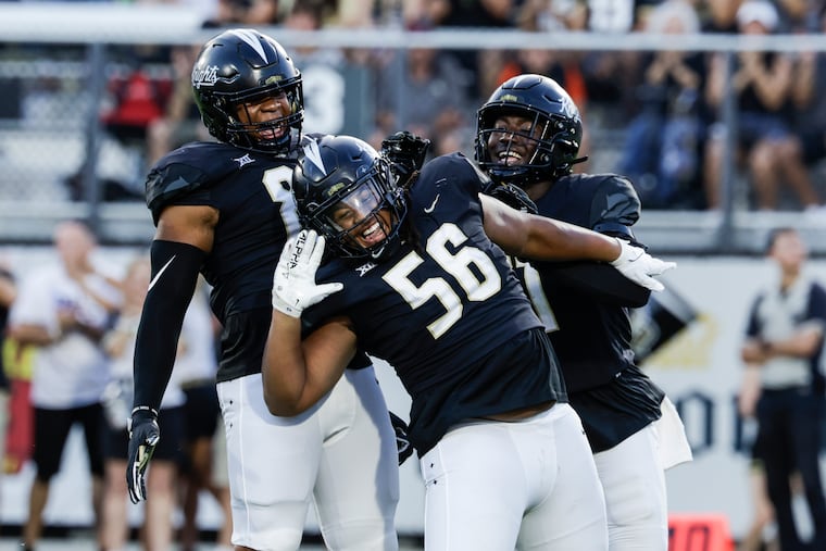 UCF defensive tackle Matthew Alexander (56) celebrates what would become a 48-14 rout against Villanova, giving the Wildcats its first loss of the season.