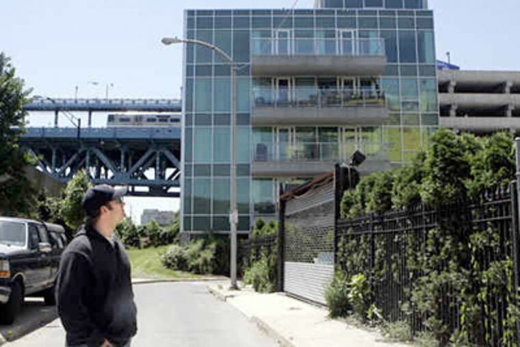 Todd Warfel, president of Nouveau's condo association, is also one of the few residents of the Nouveau complex, which has only four units occupied by owners and three rented out. (Bonnie Weller / Staff photographer)