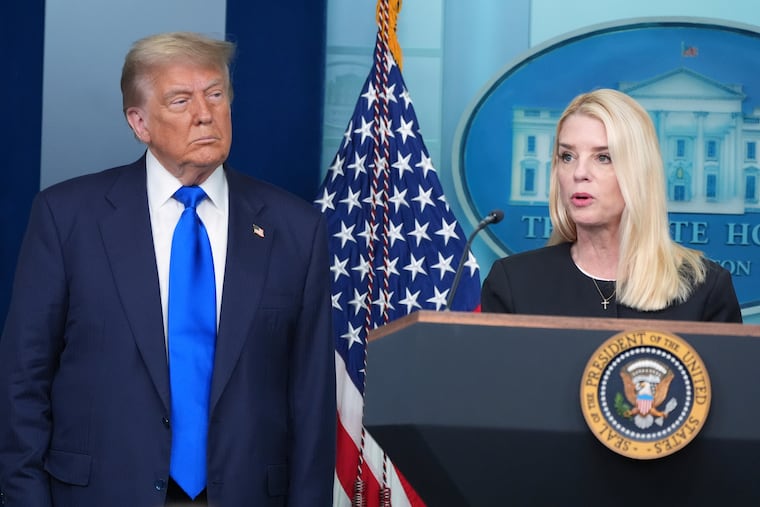 Attorney General Pam Bondi speaks to reporters as President Donald Trump listens on June 27 in the briefing room of the White House.