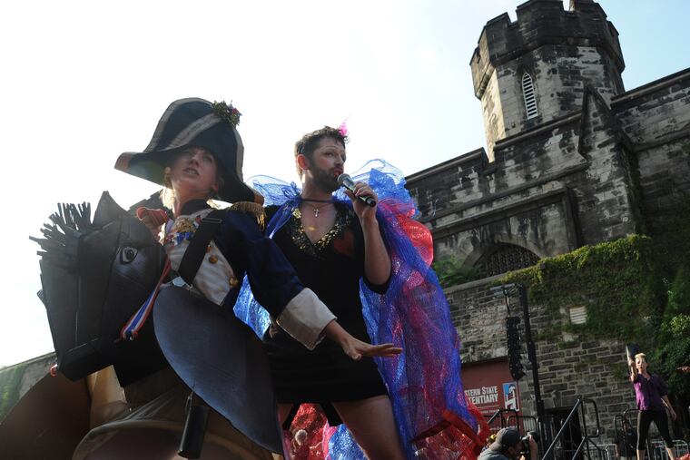 Mary Tuomanen (left), playing Napolean, and John Jarboe, in the character of Edih Piaf, of The Bearded Ladies Cabaret Company, perform on stage to during the 20th anniversary event commemorating Bastille Day at Eastern State Penitentiary July 13, 2014.