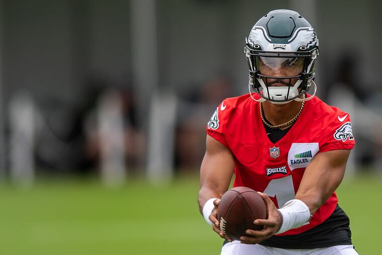 Eagles quarterback Jalen Hurts participates in a drill during training camp at the NovaCare Complex.